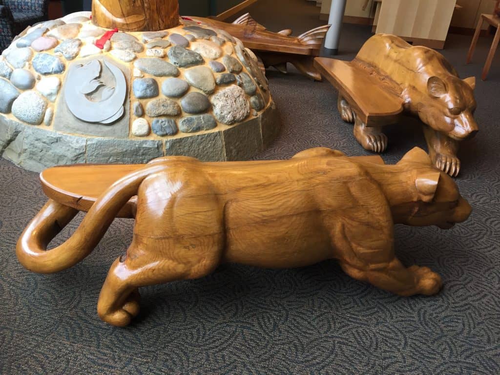 Detail of cougar bench by "We Are Here" in SOU library