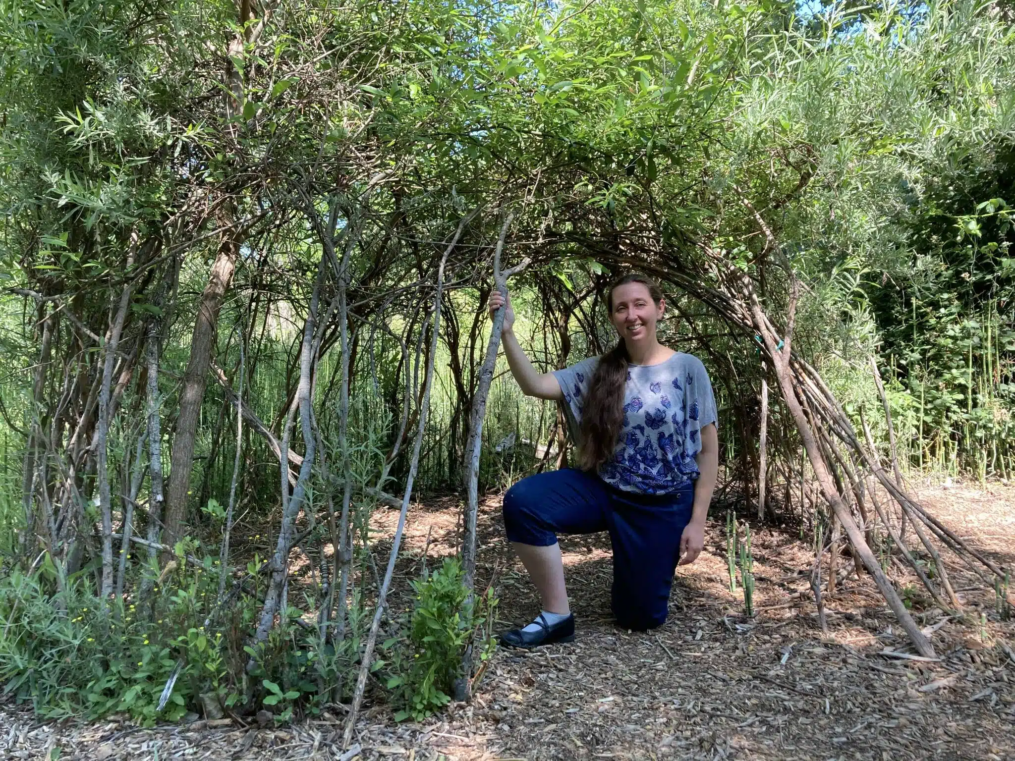 Libby VanWyhe in the Living Willow Hut eleven years after she helped create it.