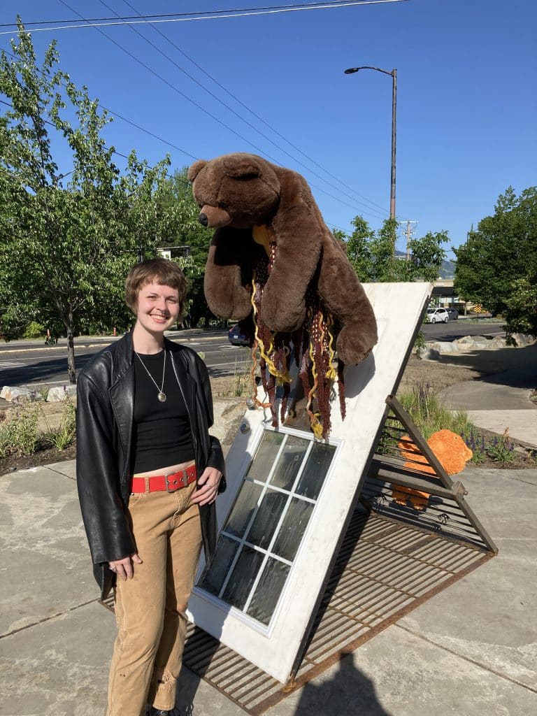 At the opening for Recology Ashland/SOU "artist in residency" program, turning "trash" into art. Photo of the artist: Cameron Daniel Whiting. Title: Orange Bear.