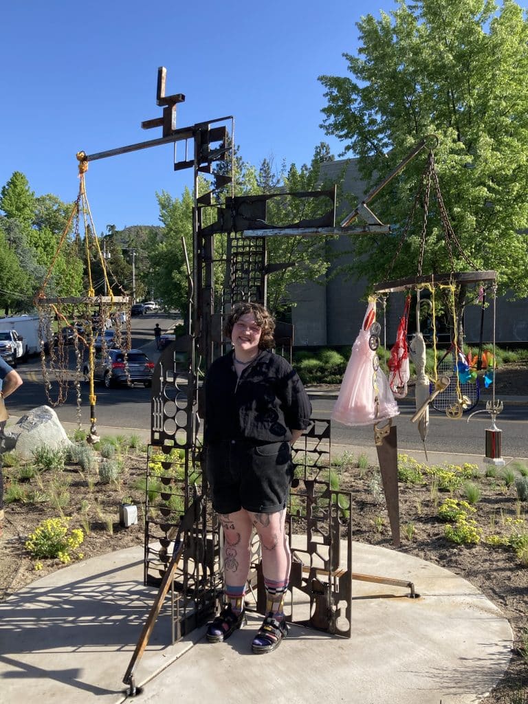 At the opening for Recology Ashland/SOU "artist in residency" program, turning "trash" into art. Artist: Naia Duggan. Title: "Child, Mother, Crone, Trash."
