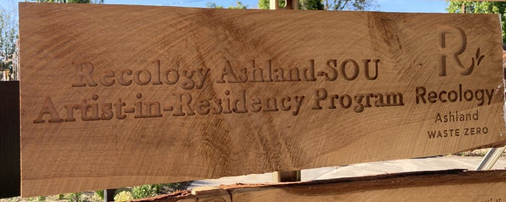 Wood sign for the Recology Ashland/SOU "artist in residency" program.