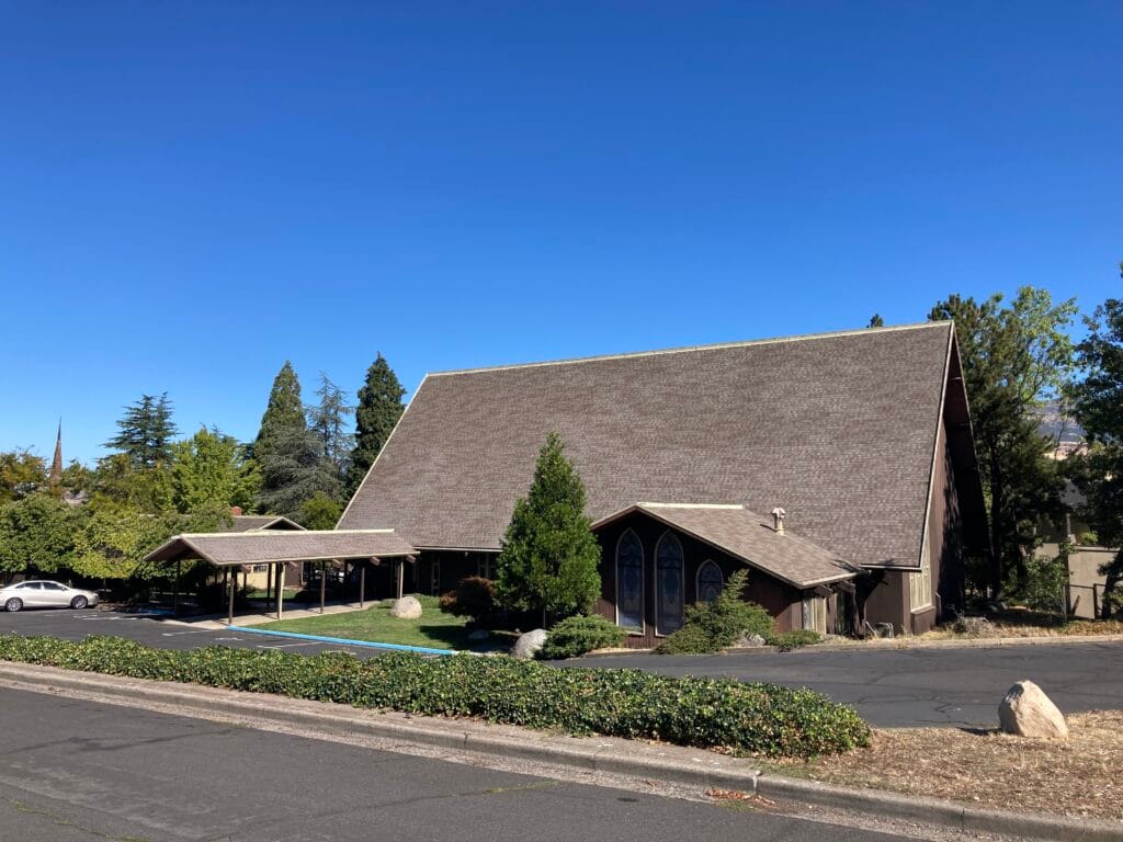First Presbyterian Church in 2025. You can see the tip of the bell tower at left of photo.