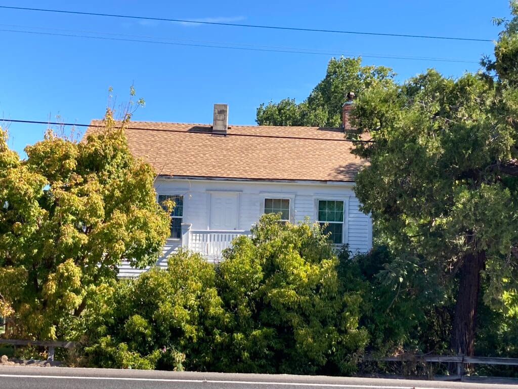 1860 farmhouse of Giles and Martha Wells and family, along what is now Highway 66.