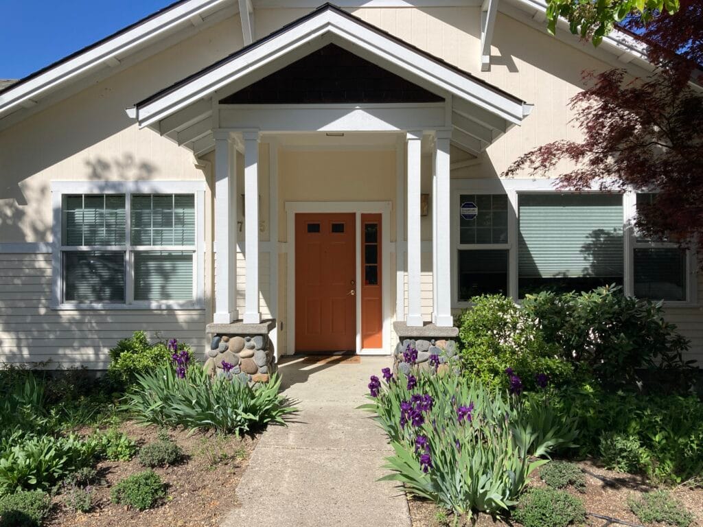 Simplified Craftsman style entrance at 745 River Rock Road.