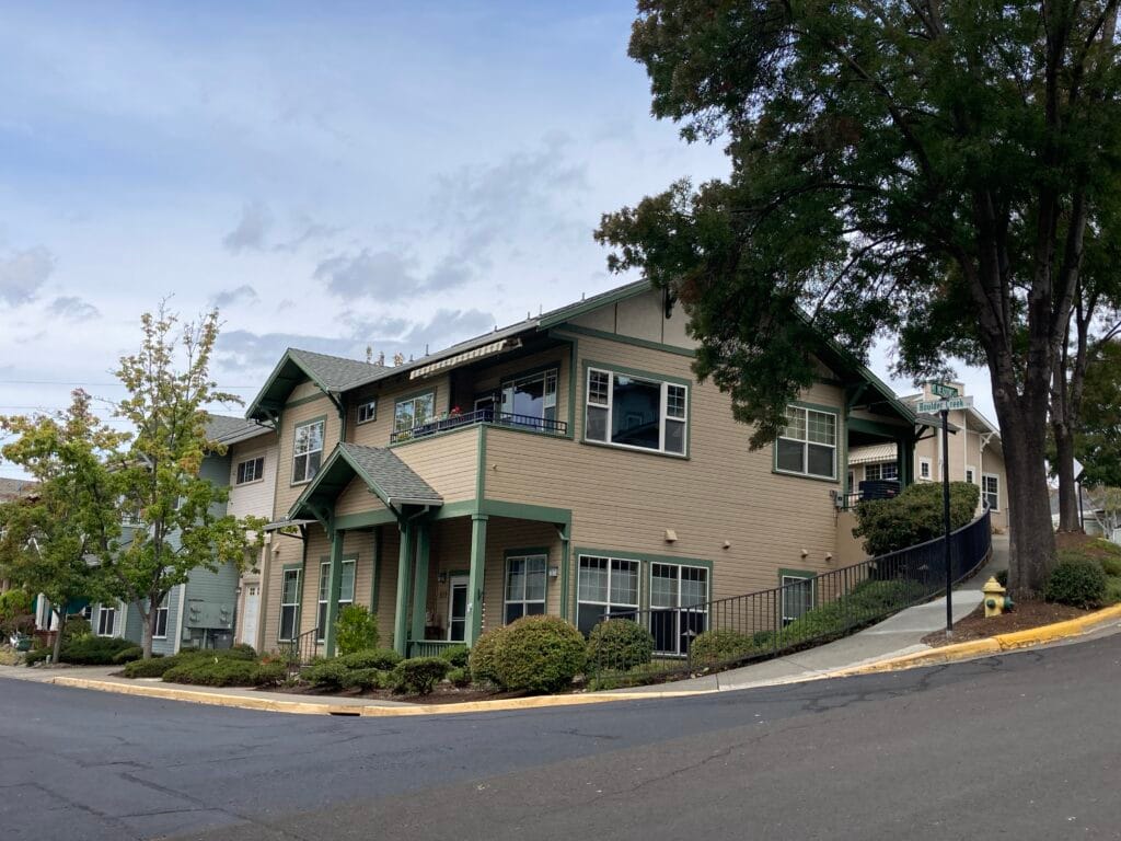 Another view of the Hillside Condominiums architecture. The lower floor is a one-story house at street level on the downhill (south) side, and the upper floor is a one-story house at street level on the uphill (north) side.