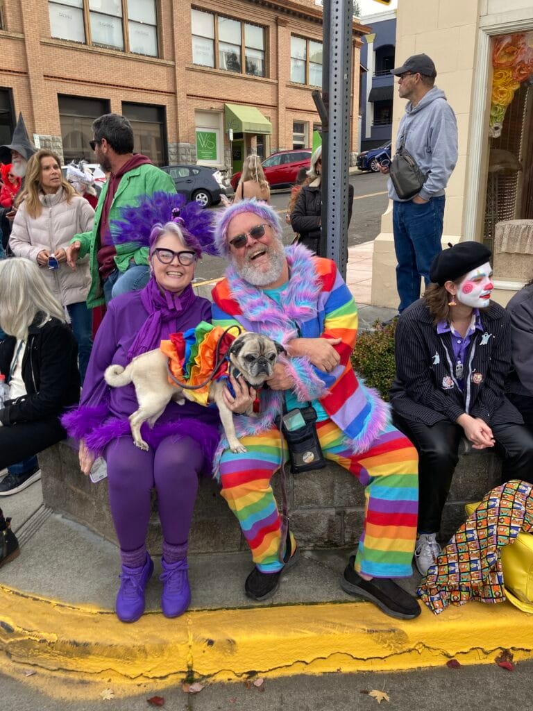Ashland Children's Halloween parade 2025 - colorful couple with a colorful dog.