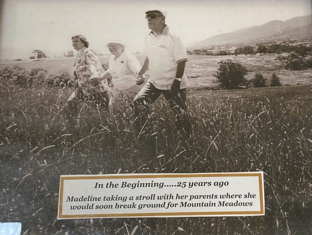 Madeline Hill with her parents Lillian and Jack Sanford, on site before Mountain Meadows was built.