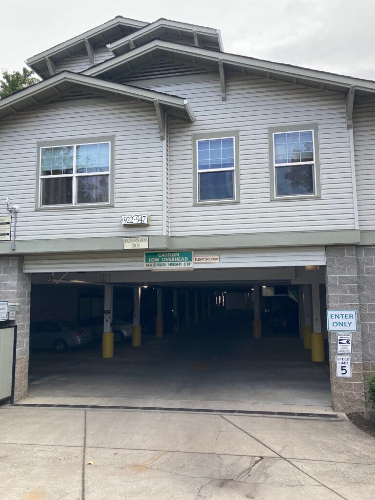 This is not only a parking garage, it is also a street! Mountain Meadows Circle runs through and underneath the Cottonwood and Birch condominium buildings.