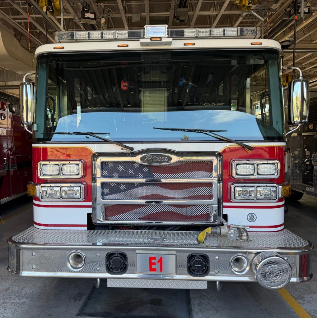 Front of an Ashland fire engine, with American flag graphic.