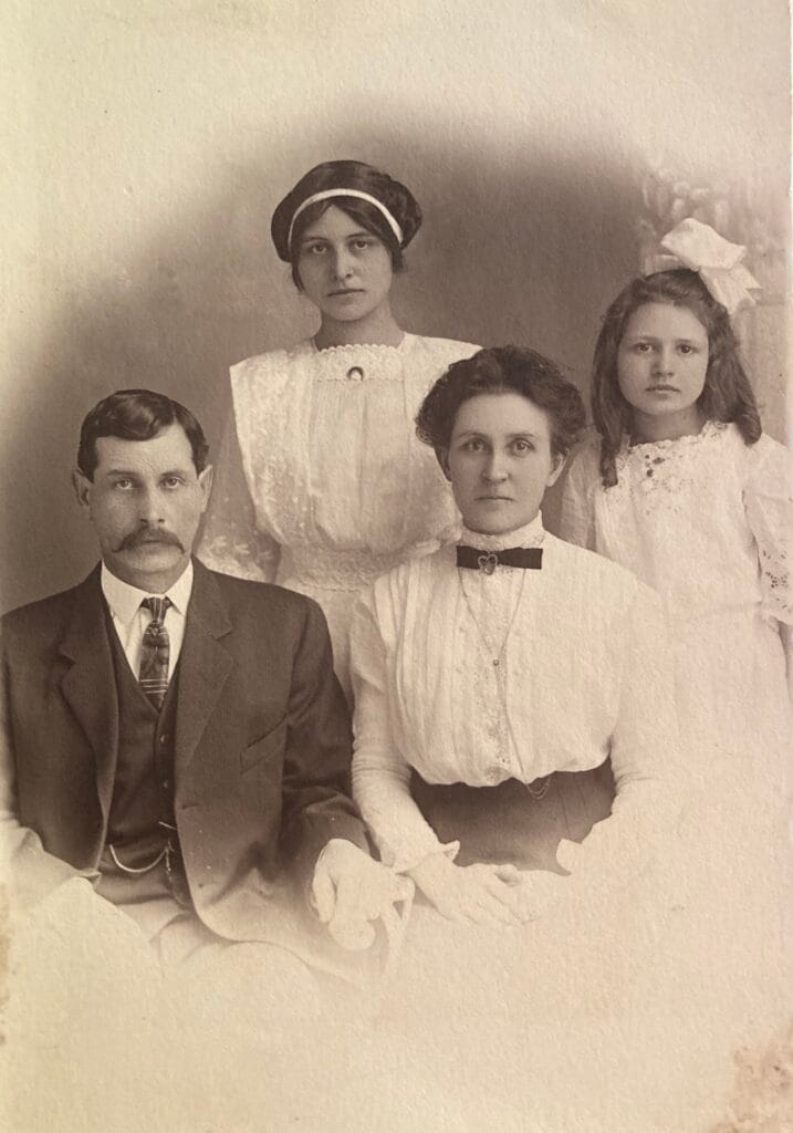 Thaddeus Powell, his wife Laura, children Hazel and Ethel. About 1915.
