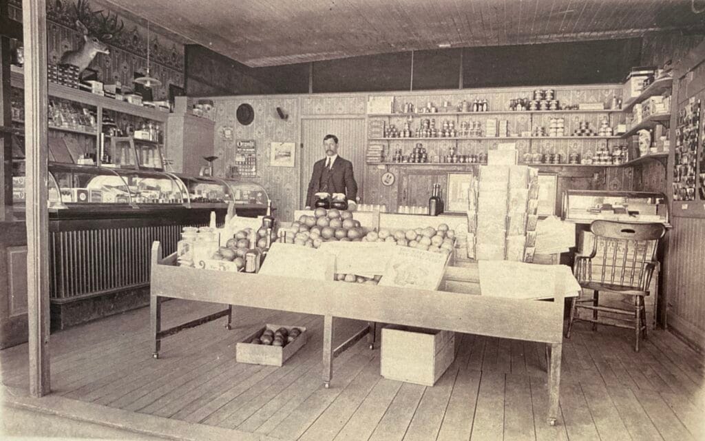 Thaddeus Powell at family store, corner of A Street and Fourth Street, 1910-1916.